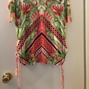 Pretty tropical print pullover shirt with fringes that tie.